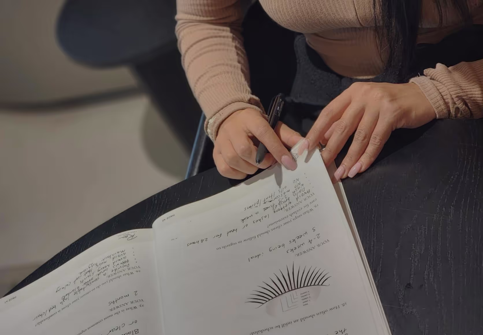 Lash student reviewing classic manual.